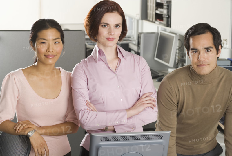 Portrait of three office workers.