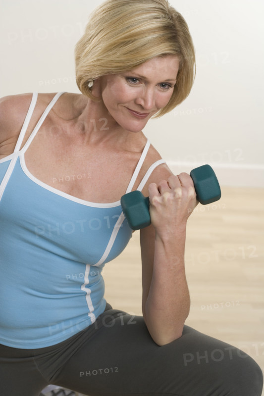 Woman lifting weights.