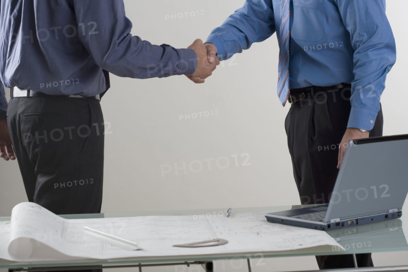 Two men shaking hands.