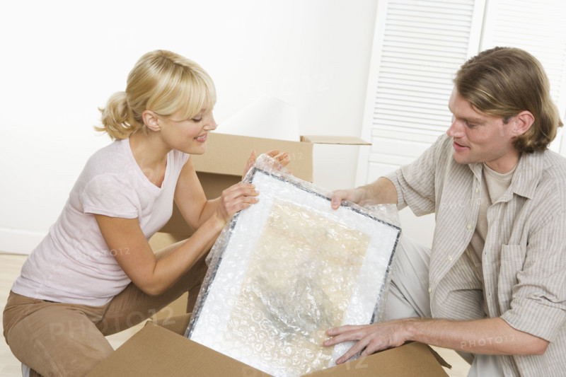 Couple unpacking after moving.