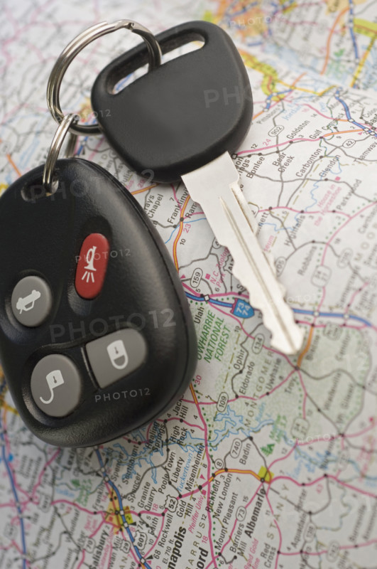 Closeup of car keys and map.