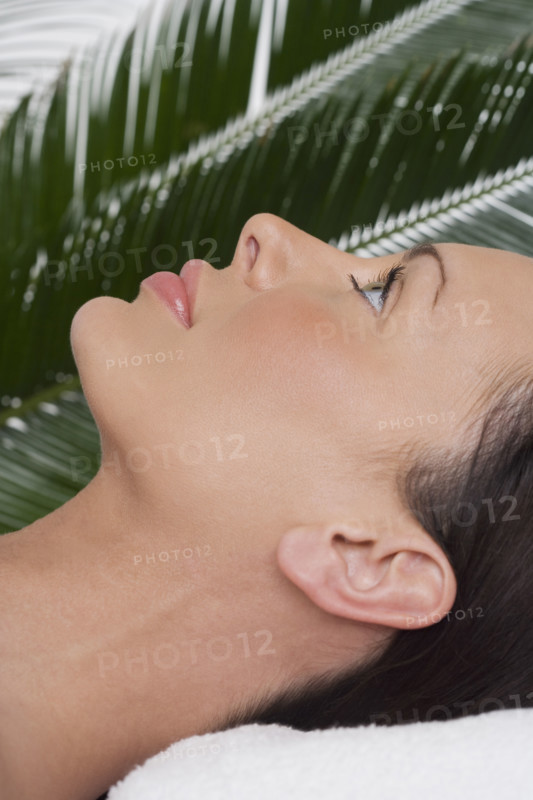 Woman lying on her back at spa.