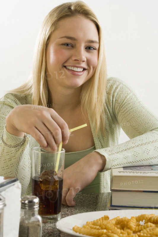 Young woman having a quick meal.