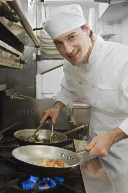 Male chef in restaurant kitchen.