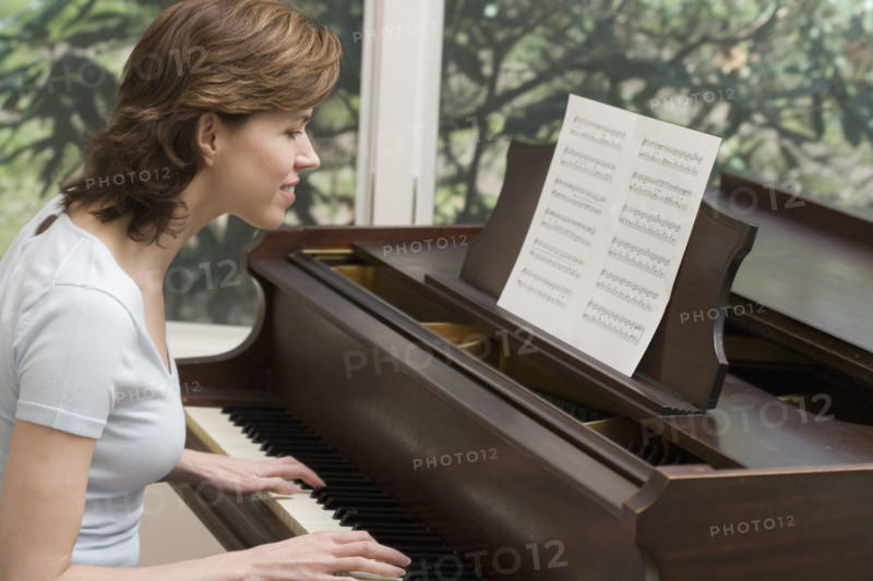 Woman playing piano.