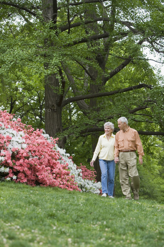 Senior couple walking outdoors.