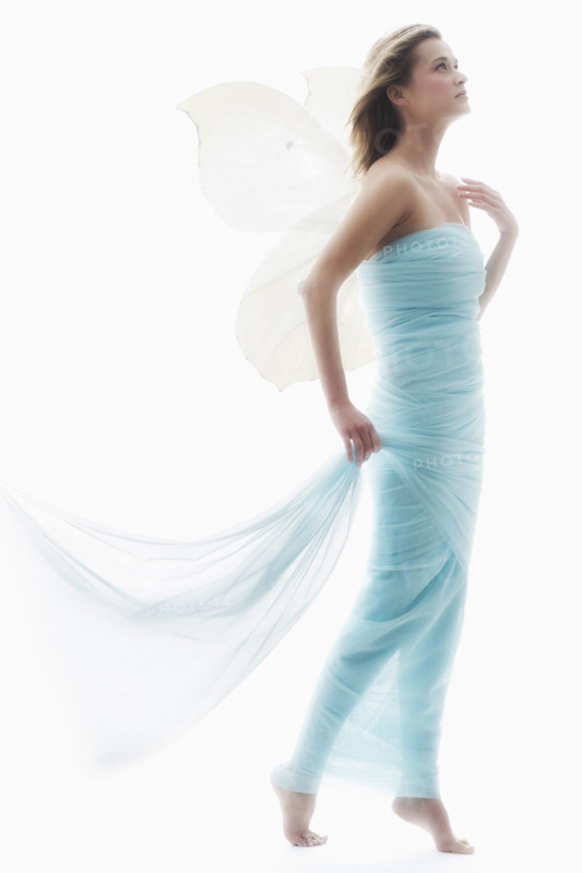 Young woman in full length gown.