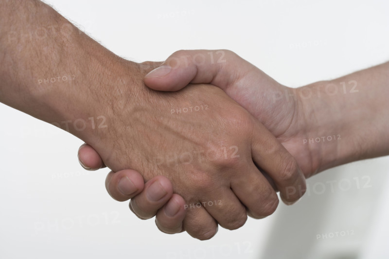 Closeup of men shaking hands.