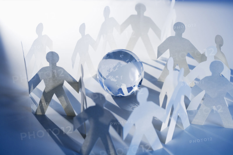 Chain of paperdoll cutouts with globe in center.