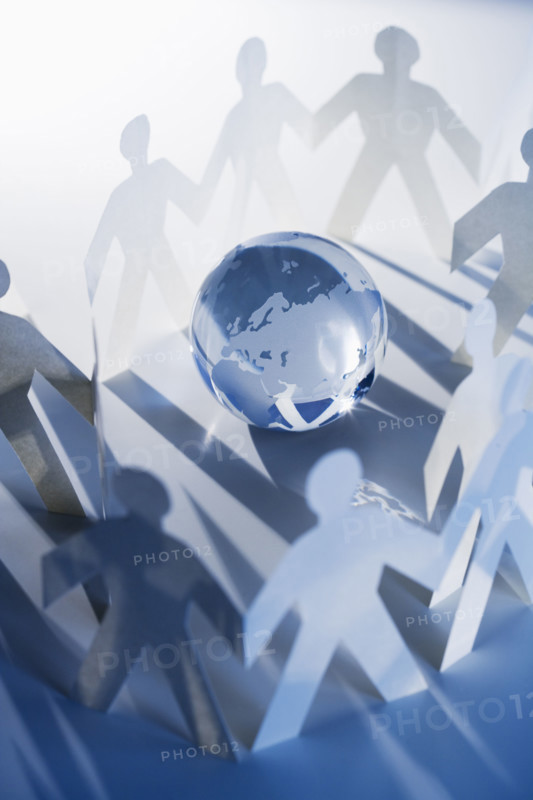 Chain of paperdoll cutouts with globe in center.