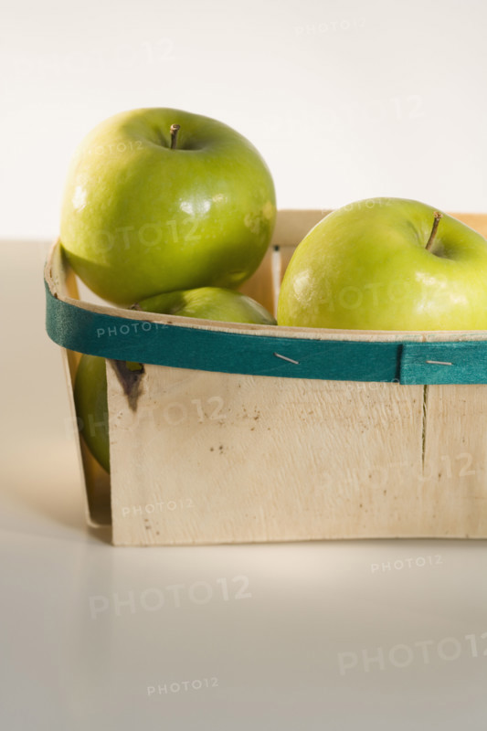Close up of apples in basket.