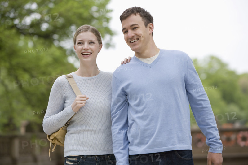Portrait of young couple outdoors.
