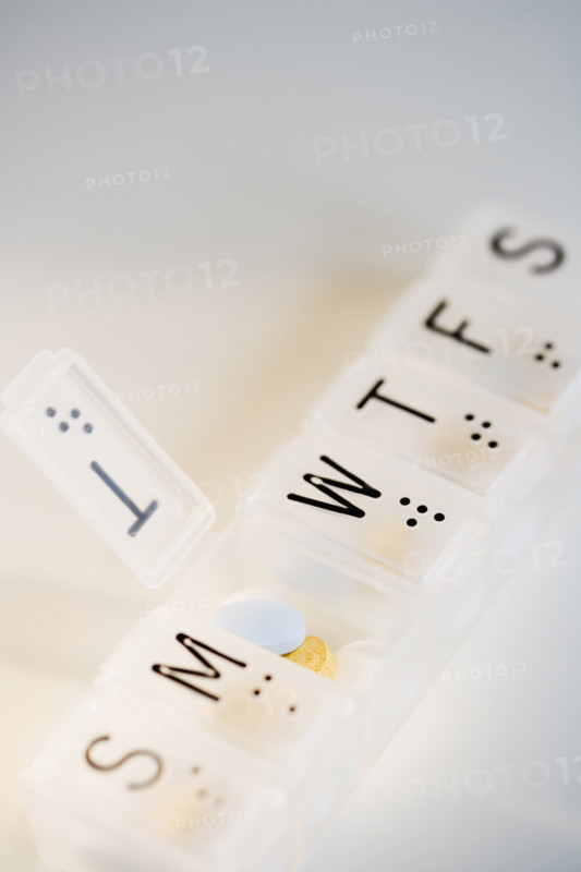 Close up of pill organizer.