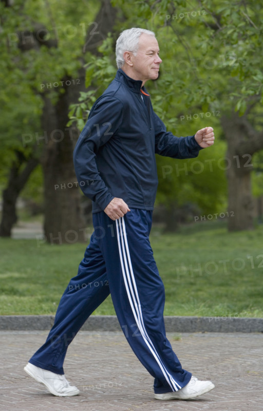 Senior man power walking.