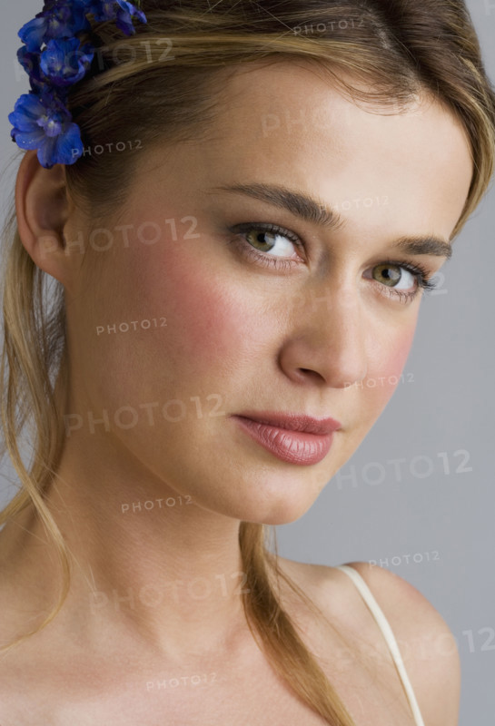 Young woman wearing a hair ornament.