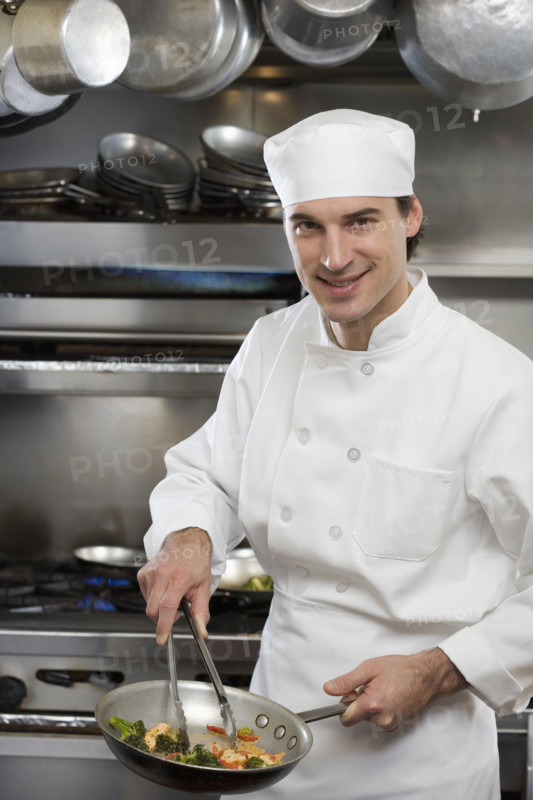 Male chef in restaurant kitchen.