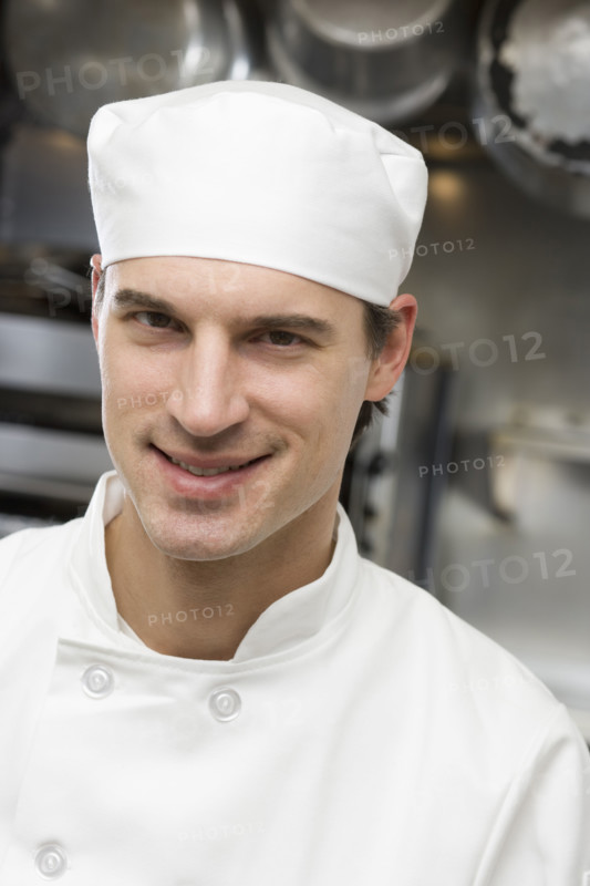 Male chef in restaurant kitchen.