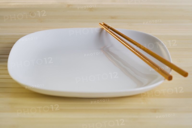 Close up of plate with chopsticks.