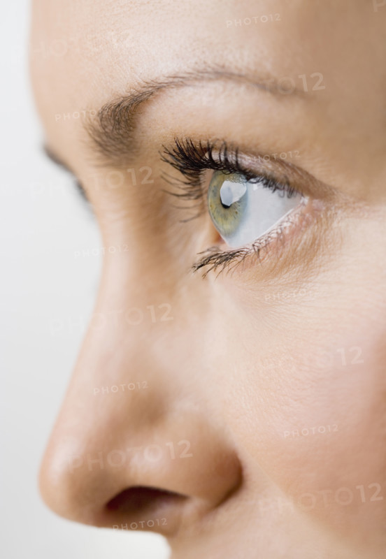 Close up profile of a womans face.