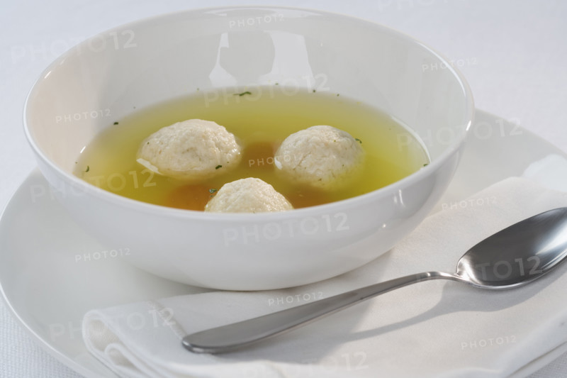 Close up of Matzah ball soup.