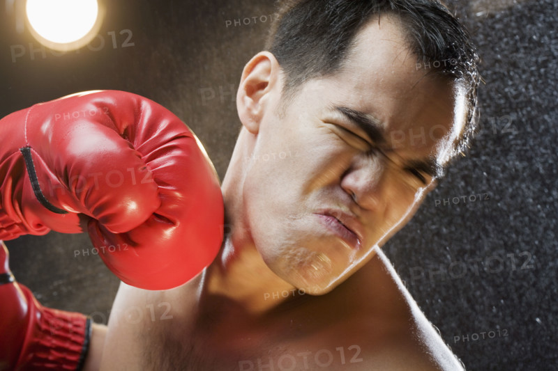 Boxer taking a punch to the head.