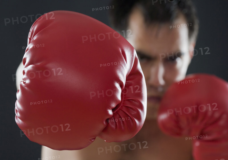 A boxer throwing punches.