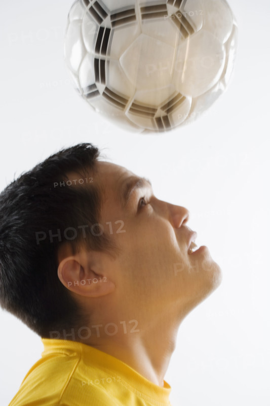 Man playing with soccer ball.