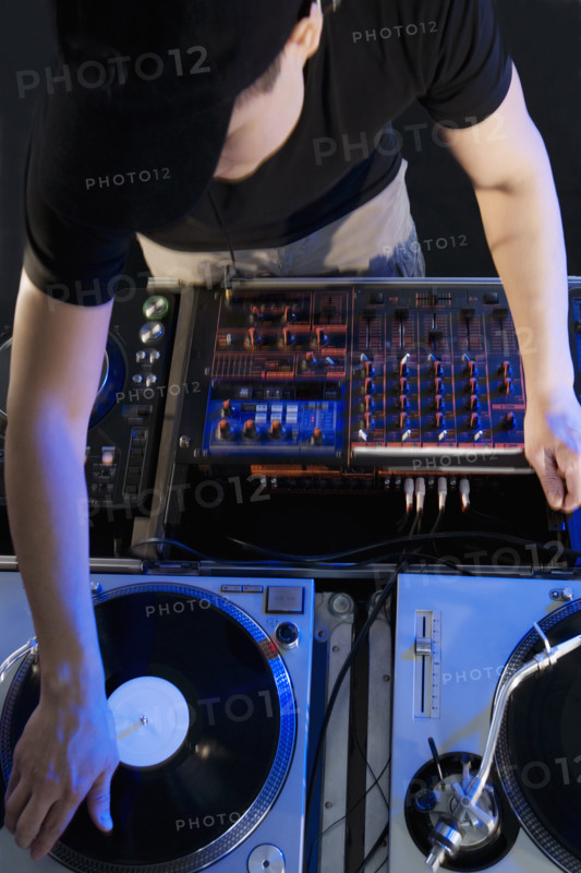 Man mixing music in a nightclub.