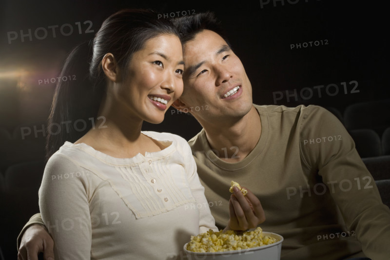 Couple watching a movie.