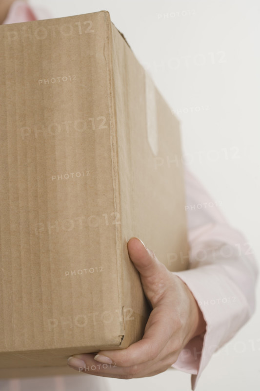 Woman carrying a box.
