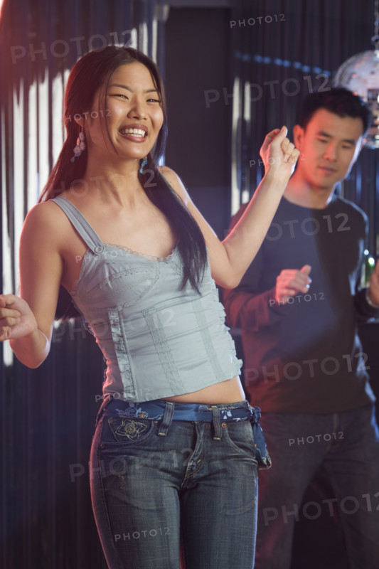 Couple dancing in a nightclub.