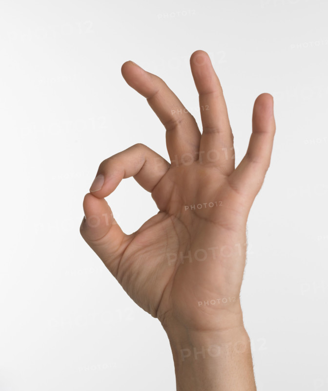 Studio shot of hand giving the okay sign.