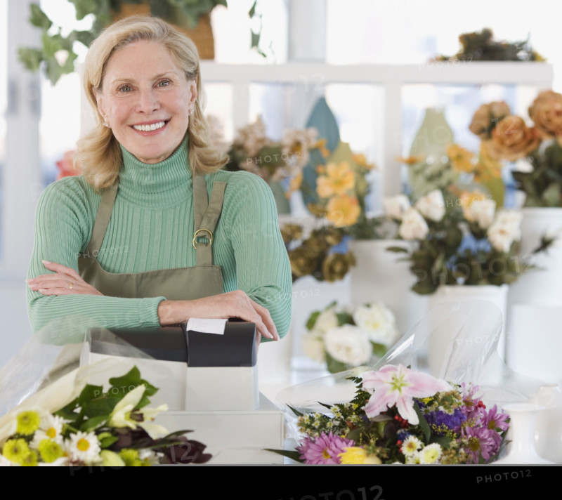 Portrait of female florist at cash register.