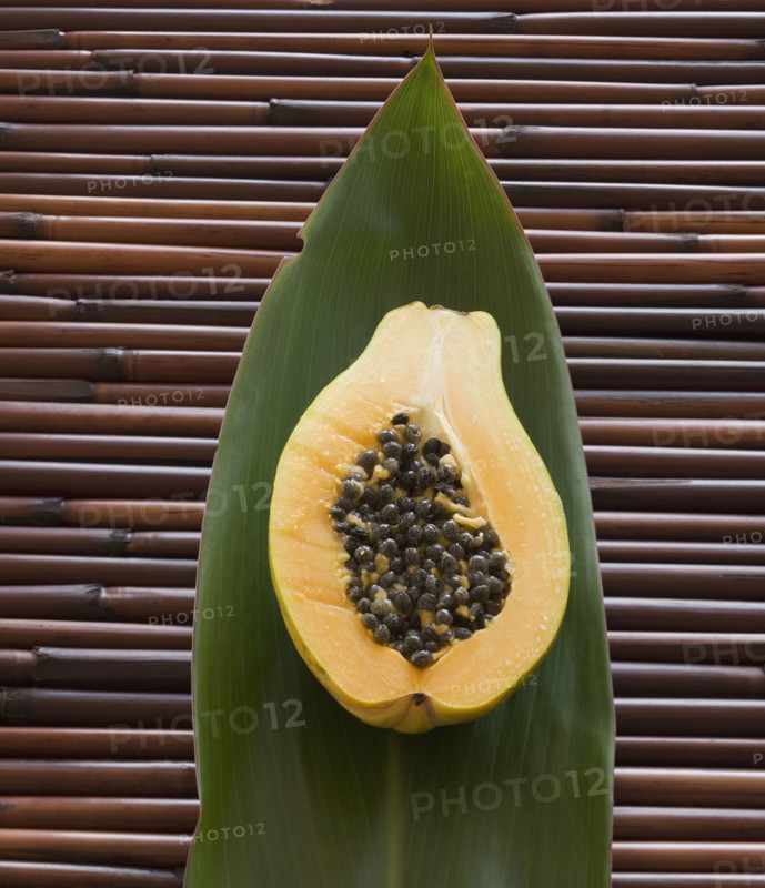 Close up of cut open fruit on leaf.