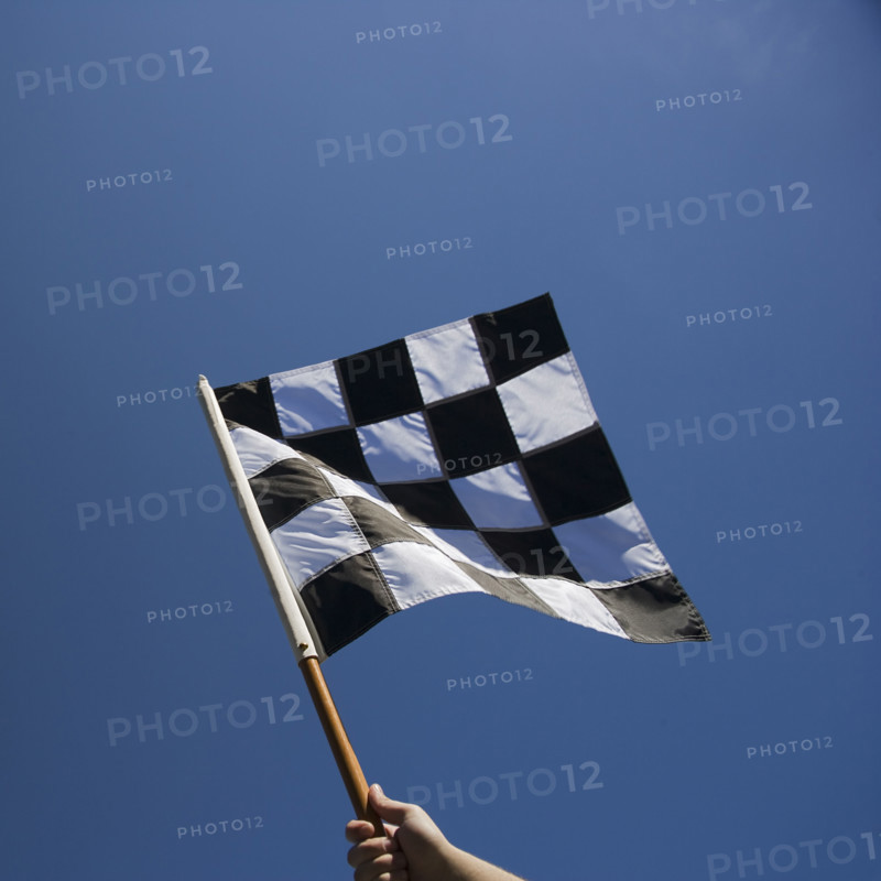 Checkered flag with blue sky.
