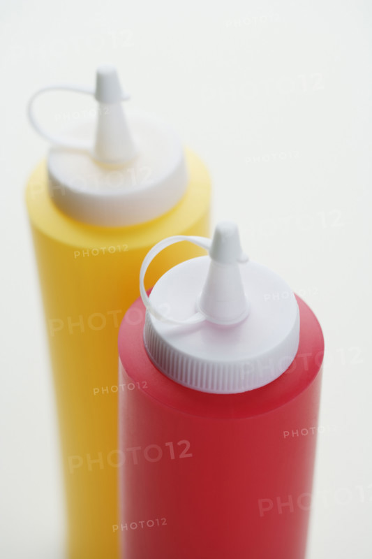 Close up of ketchup and mustard bottles.