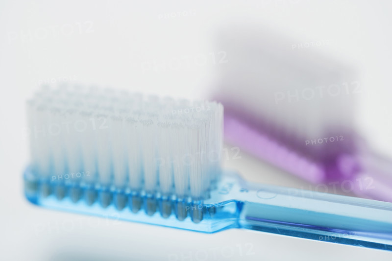Close up of toothbrushes.