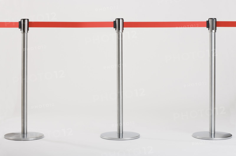 Studio shot of retractable belt crowd control barriers.