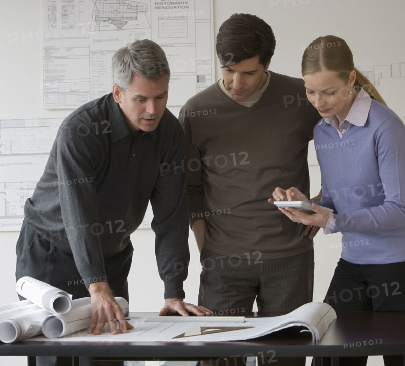 Businesspeople in architect’s office.