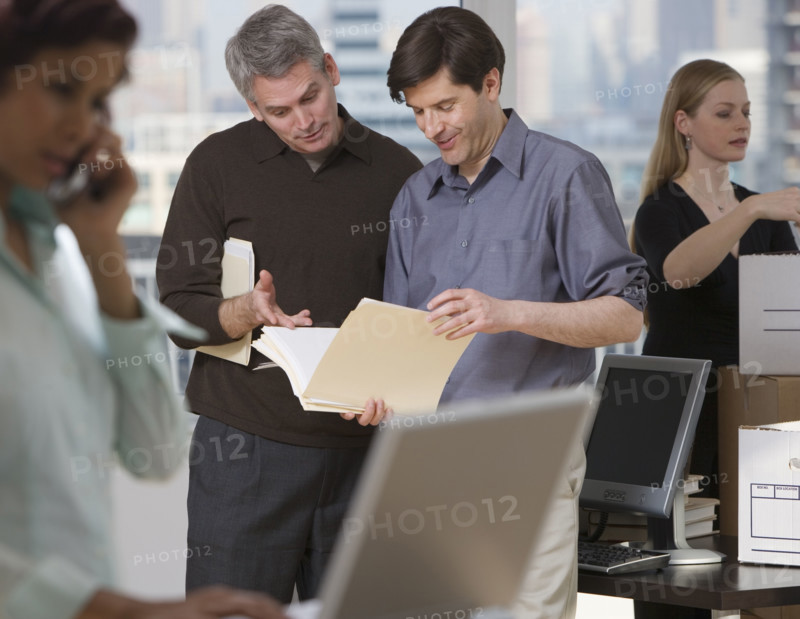 Businesspeople working in new office.