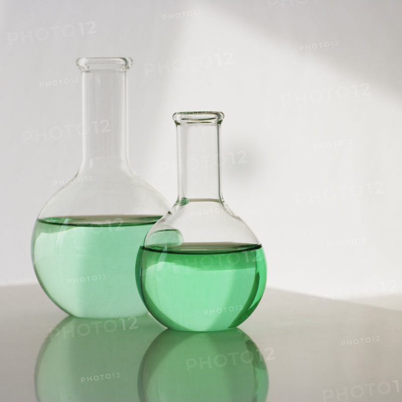 Two beakers with liquid.