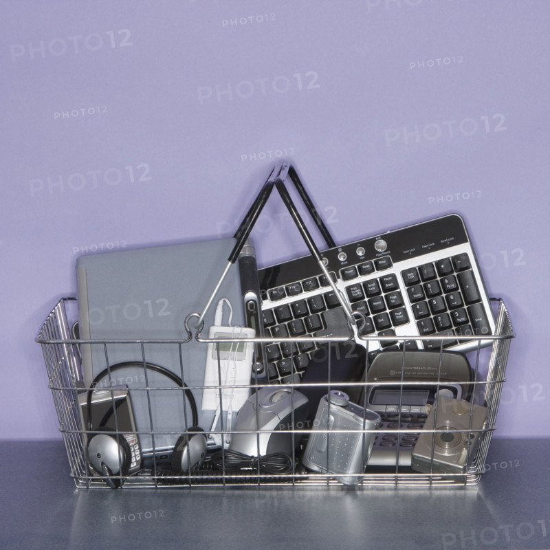 Shopping basket filled with electronics.