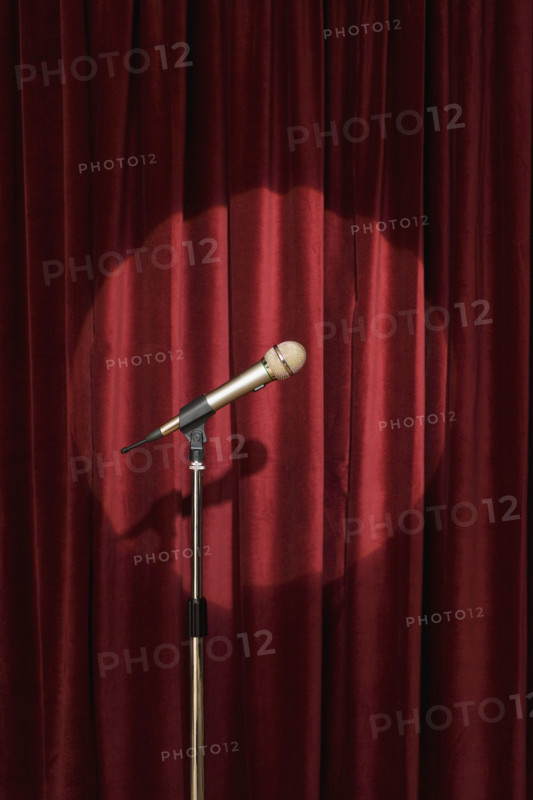 Spotlight on microphone on stage.