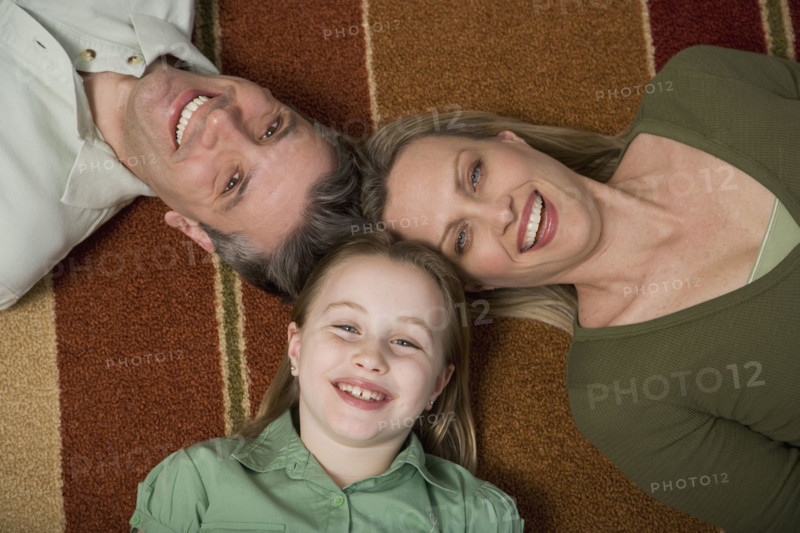 High angle view of family on floor.