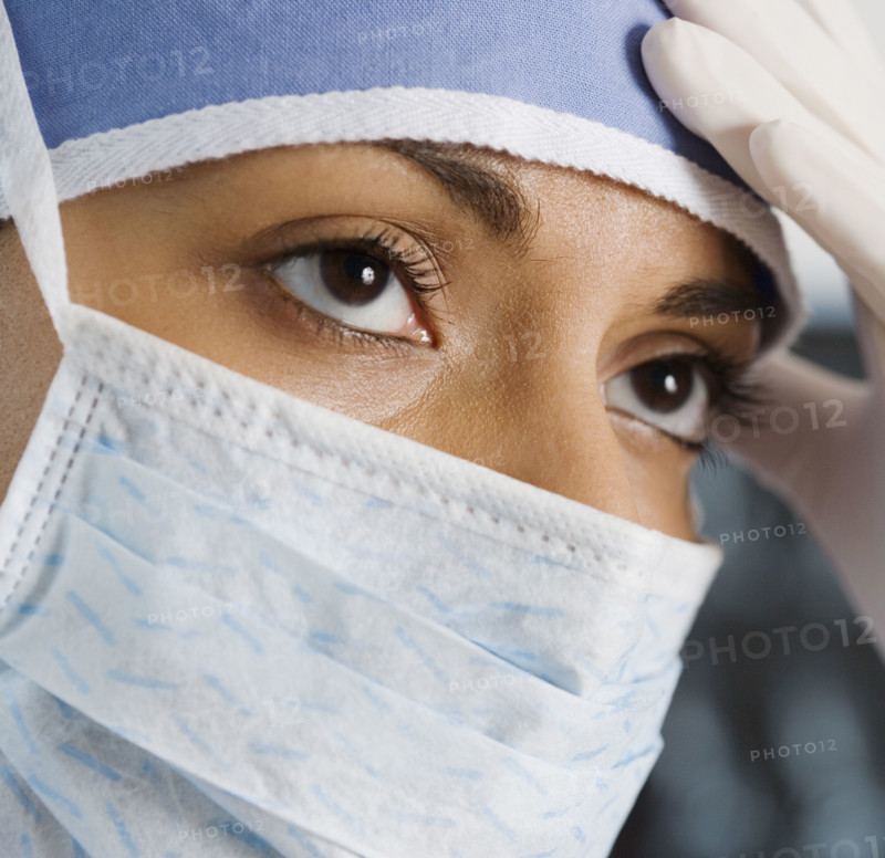Indian female doctor wearing surgical mask.
