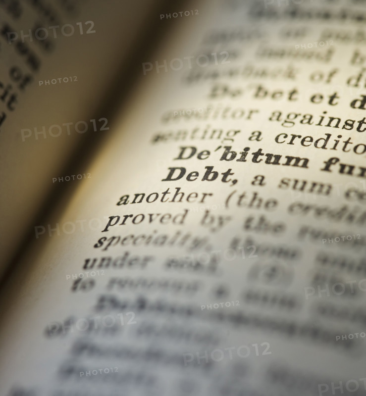Close up of Debt in the dictionary.