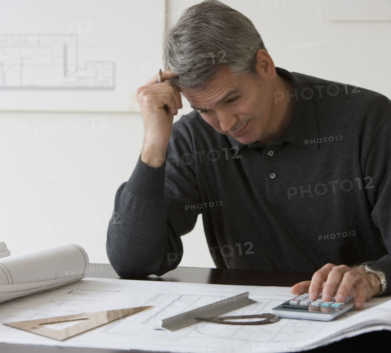 Male architect working at desk.