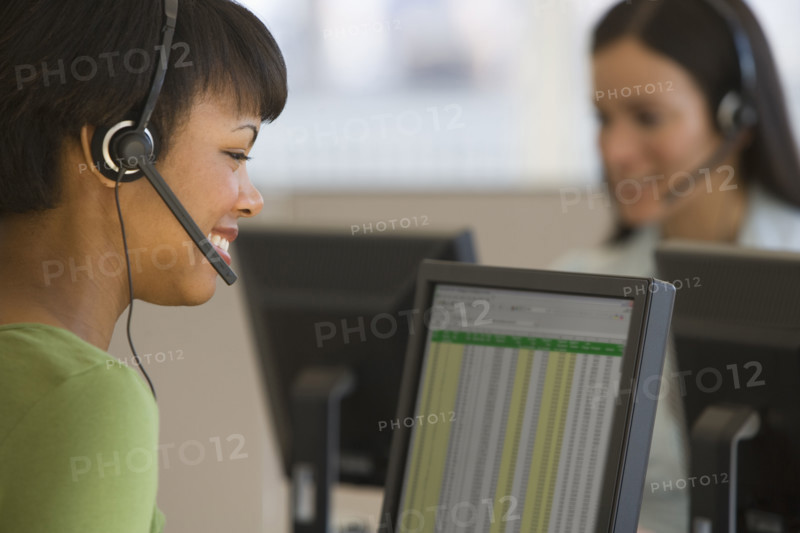 African businesswoman wearing headset.