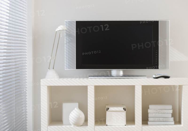 Flat screen television on shelf.