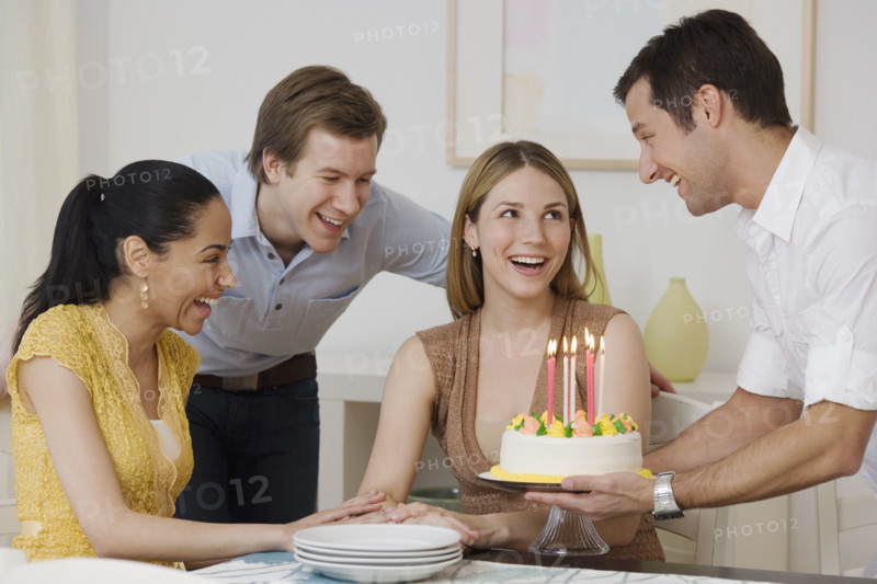 Woman celebrating birthday with friends.